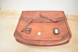 A vintage leather briefcase/messenger bag measures 40cm x 32cm.