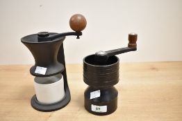 A 20th century cast iron coffee grinder having ceramic container and wooden handle, h18cm, sold