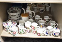 An assortment of Portmeirion 'Welsh Dresser' ware including plates, jugs, mugs and teapot,