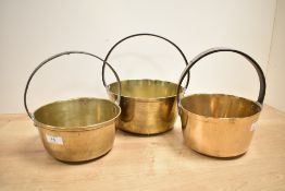 A group of 3 brass jam pans having iron handles, largest w11cm x h20cm