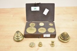 A set of brass weights in wooden case, sold alongside stacking weights and a half ounce weight ect