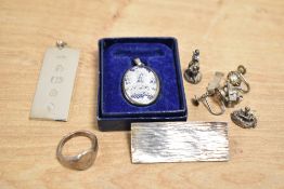 A 1977 silver ingot pendant, along with a small selection of silver and white metal jewellery