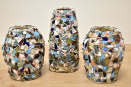 A group of three 'pique assiette' mosaic embellished vases, two stoneware and one glass, tallest
