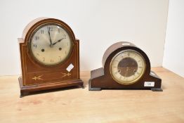An early 2oth century inlaid mahogany mantel clock, of arched form with boxwood strung detail, the