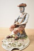 A 20th century ceramic figure of a gentleman smoking a pipe, signed Lucia to base, h28cm