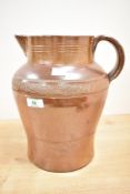 A 19th century salt-glazed stoneware jug, of generous proportions and decorated with a band of