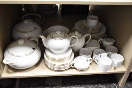 A Harmony fine bone china part dinner service, decorated with gold colour edge and border on a white