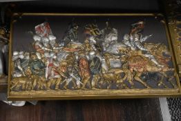 A group of three 'Marcus Designs' cast plaster Medieval scene panels, depicting the battle of
