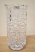 A heavy hand cut crystal vase, decorated with floral motifs and supported on a footed base, h28.