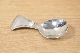 A Keswick School of Industrial Art Firth Staybrite caddy spoon. marked 'Keswick' to reverse, L9cm