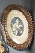 A late 19th/early 20th century 'Tramp Art' oval picture frame, intricately constructed out of