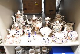 A large assortment of Mason's ironstone and similar to include teapots, mantel clock and ginger jars