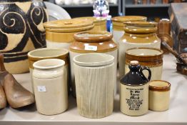 A group of eleven salt glazed stoneware pots and similar, largest measuring 22cm tall.