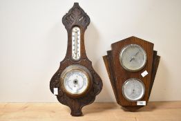 An early 20th century Aneriod barometer with carved oak case and thermometer scale 47cm sold