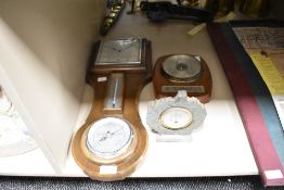 A Smith oak cased 8-day combinationwall clock, having temperature and barometer gauge, 50cm, sold
