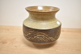A 20th century studio pottery vase of baluster form, decorated with geometrical patterns on a