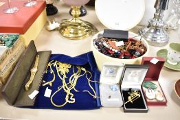 A selection of costume jewellery to include broaches, watches and necklaces etc.
