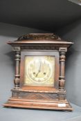 A 19th century mahogany 8-day bracket clock having brass chapter ring, a pair of doric columns