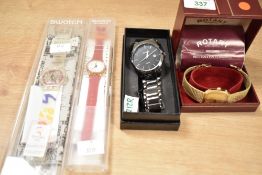 A boxed gold tone Rotary wristwatch, along with two cased Swatch wristwatches and a Curren