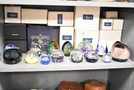 A collection of fifteen glass paperweights, mainly Caithness and including Millefiori Crown (