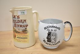 A Lyle's Golden Syrup ceramic pitcher, h17.5cm sold together with a Buchanan's pitcher, (2)