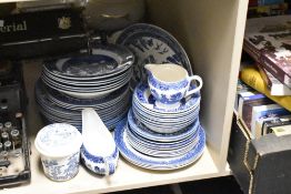 An assortment of blue and white ware to include plates, bowls and gravy boat etc.
