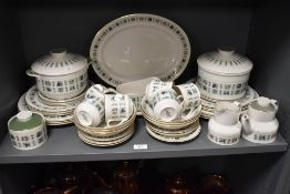 A Royal Doulton Tapestry pattern tea service, decorated with fruit and foliage on an ice white