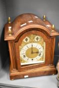 A 19th century mahogany cased dome-top bracket clock having engraved brass and silvered style