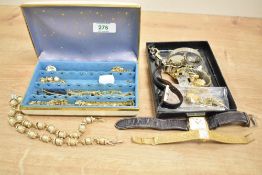 A collection of costume jewellery, including beaded jewellery, shell jewellery and wristwatches