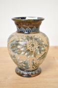 A Doulton Lambeth vase of baluster form decorated with floral and geometrical patterns, impressed