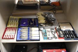 An assortment of miscellaneous cutlery and flatware including knives, forks and spoons etc.