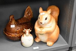 A ceramic squirrel cookie jar, h27cm, sold together with a egg basket and mustard pot, (3)