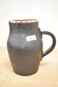 A 19th century Doulton Lambeth stoneware jug having leather style jacket and silver rim,