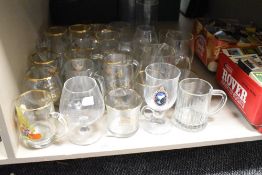 A job lot of glass tankards and sherry glasses, to include a Vale Lodge Mason glass and a half