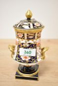A Royal Crown Derby Imari pattern pedestal urn and cover, printed and painted marks to base, 15cm