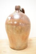 A stoneware flagon having shaped handle and impressed mark for 'T.Moody Bruton' and number '2',