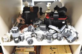 A large assortment of cameras, photography equipment and accessories to include a Minolta Dynax 5,