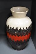 A West German fat lava style vase, decorated with red glaze and geometrical patterns, impressed mark