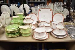 A Melba fine bone china tea service decorated in the Art Deco style having red geometric patterns on