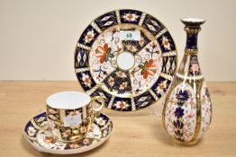 A Royal Crown Derby '2451' pattern cup and saucer having gilt edge and handle, h6cm, sold together