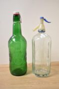 A 20th century glass Hooper Struve bottle, h32cm, sold together with a green glass Groloch