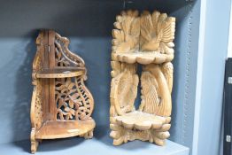 A small decorative carved oak two-tier corner shelf, carved with foliage and birds 47cm sold along