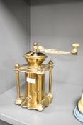 A brass coffee grinder having shaped handle with pierced decoration, h24cm