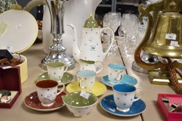 A thirteen piece miscellaneous Susie Cooper Gold Star coffee set, comprising colours red, yellow
