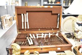 An oak canteen of silver plated cutlery, the knives marked Hammond Creake & Co, canteen measures
