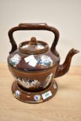 A late 19th/early 20th century barge ware pottery 'Forget Me Not' teapot and stand, treacle glazed