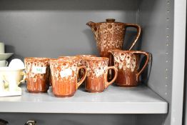 A 1970's Kernewek Pottery (Goonhavern, Cornwall) part coffee service, comprising coffee pot, milk