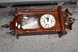 A 31 day mahogany cased wall clock, L70cm