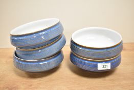 A group of five Denby stoneware bowls, decorated with a linear band and mottled blue glaze,