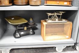 A Johnson of Hendon balance scale with glass and wood display case, w31cm, sold together with